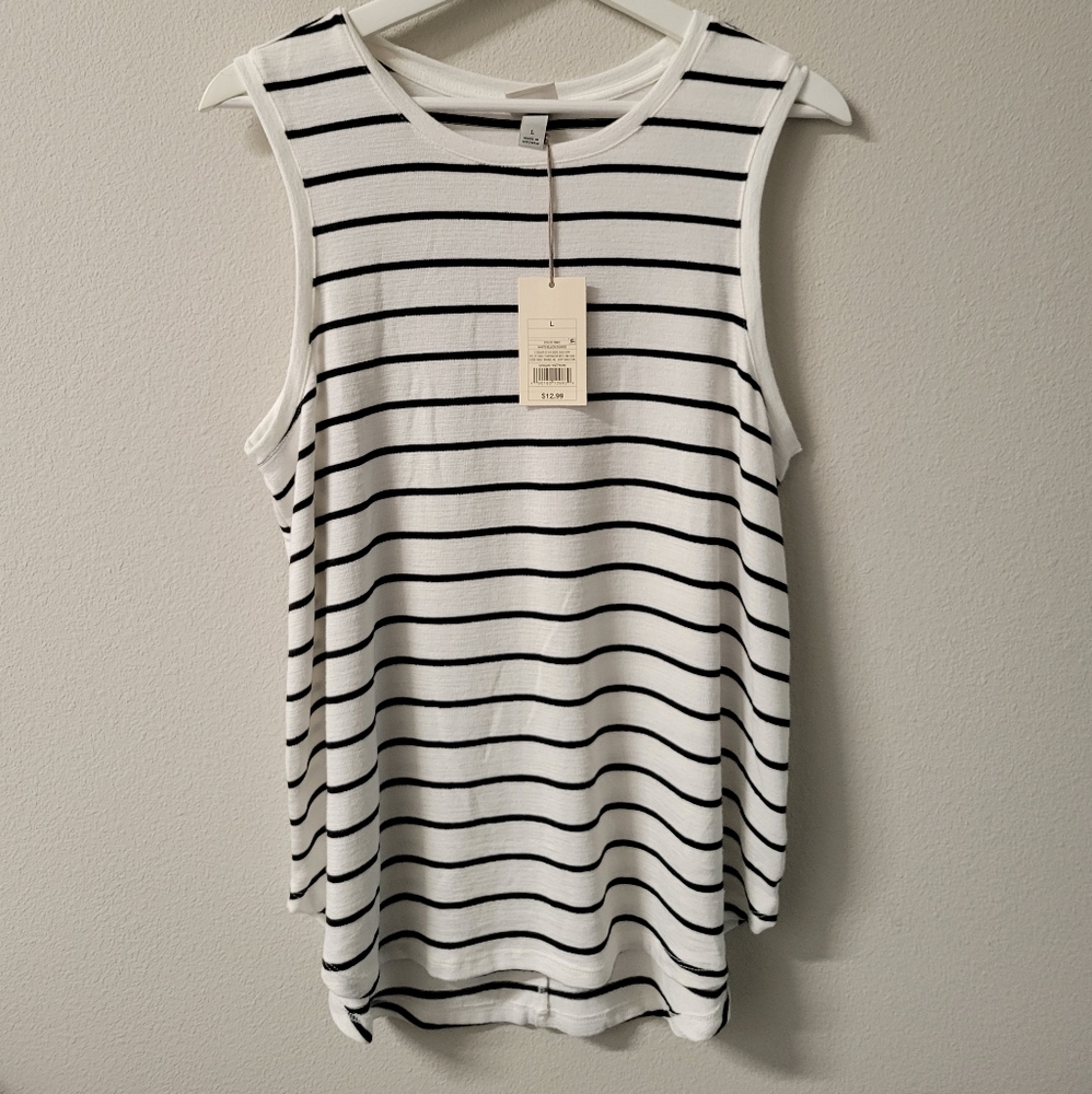 Cream color sleeveless shirt with black stripes